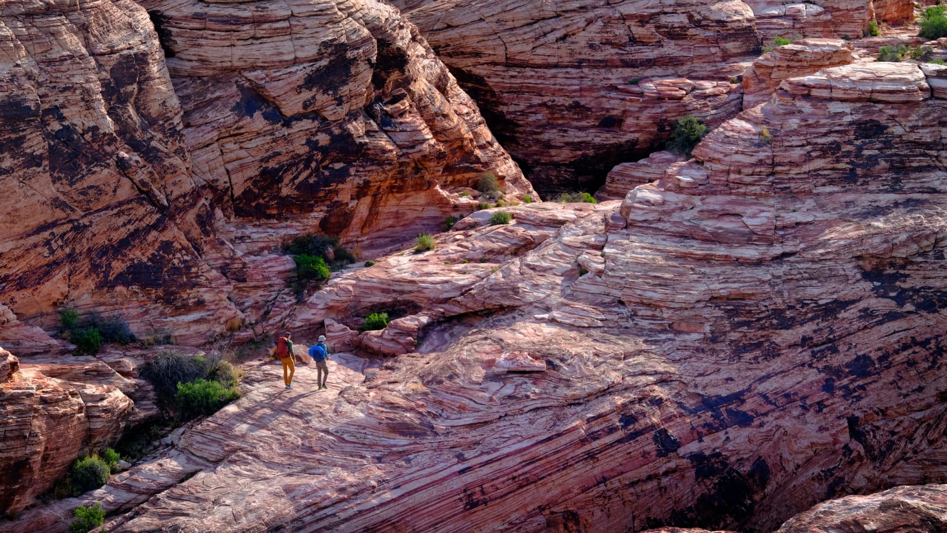 People Hiking and Climbing in the Red Rock Area of Las Vegas Nevada stock photo