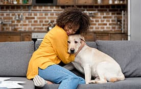 Woman Hugging Dog