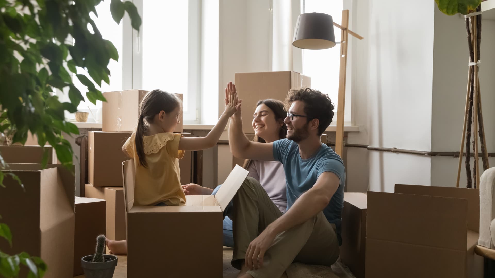 Family with moving boxes