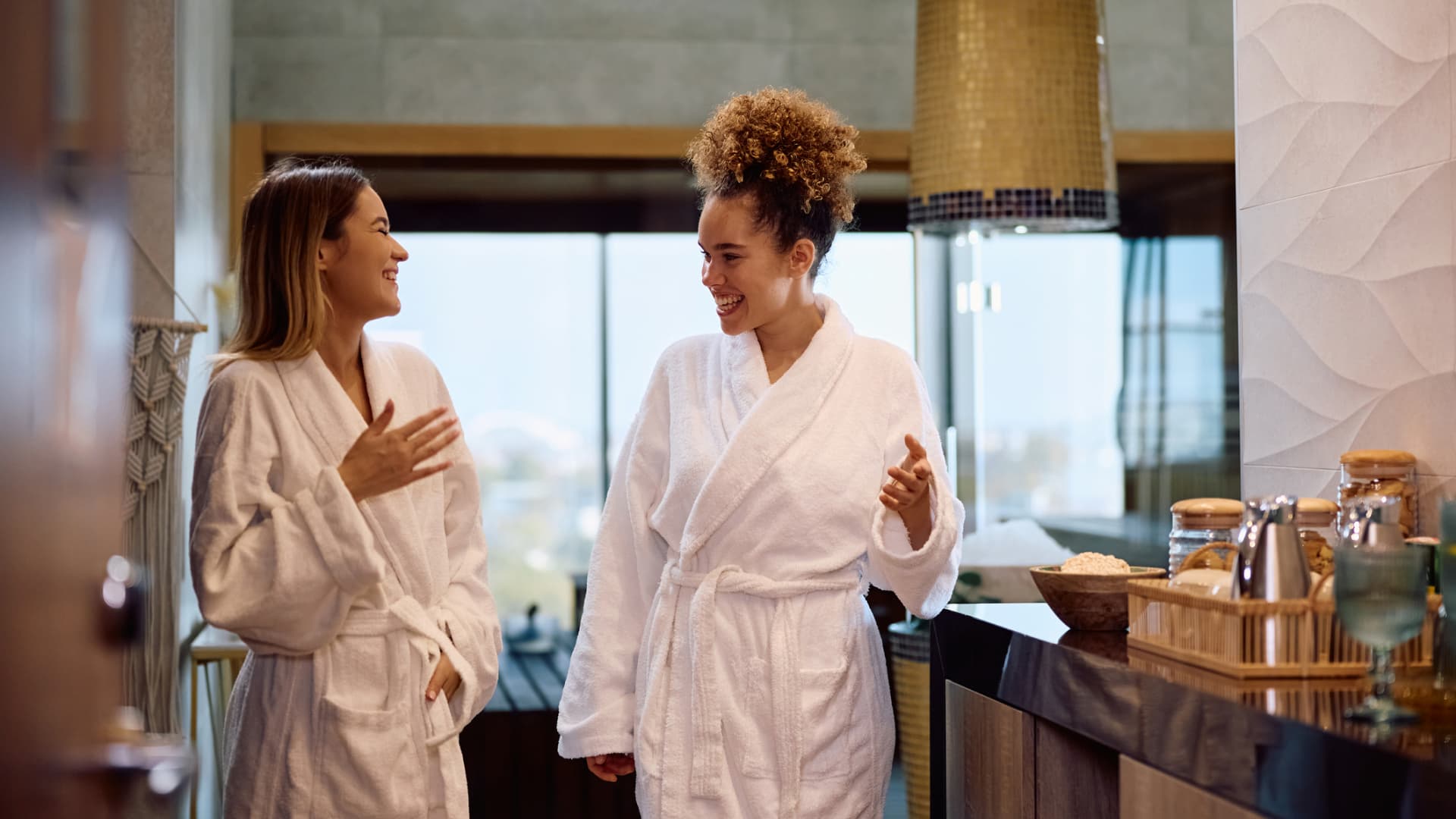 two ladies resting in robes at a spa