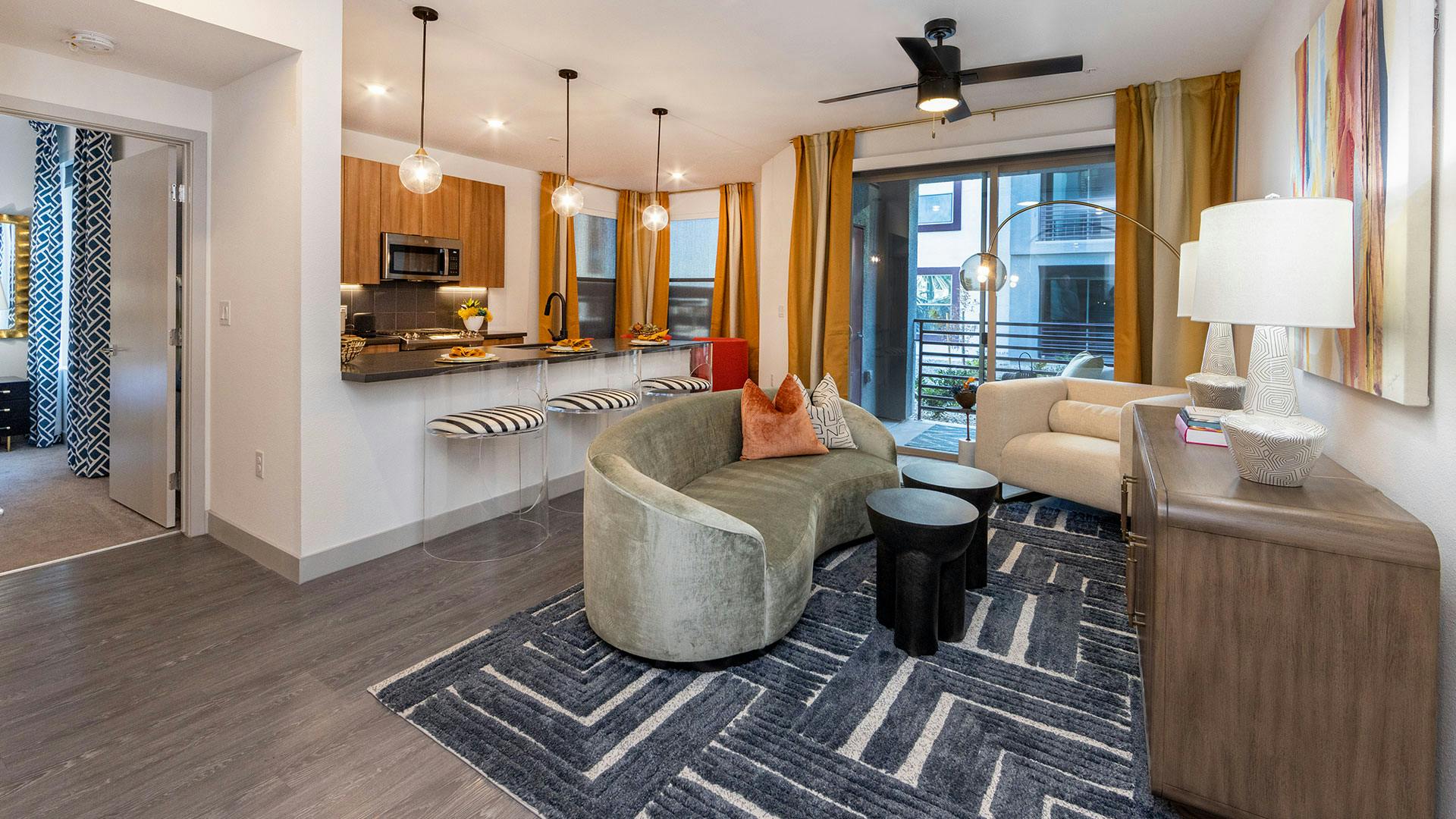 Model apartment living room with balcony at Elysian at Sunset